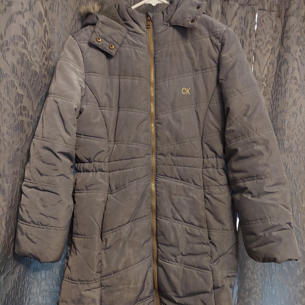 Girls winter coat by Calvin Klein. Size large and gray in color with faux fur.